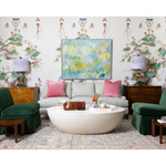 side tables with lamps and green chairs and pale blue couch