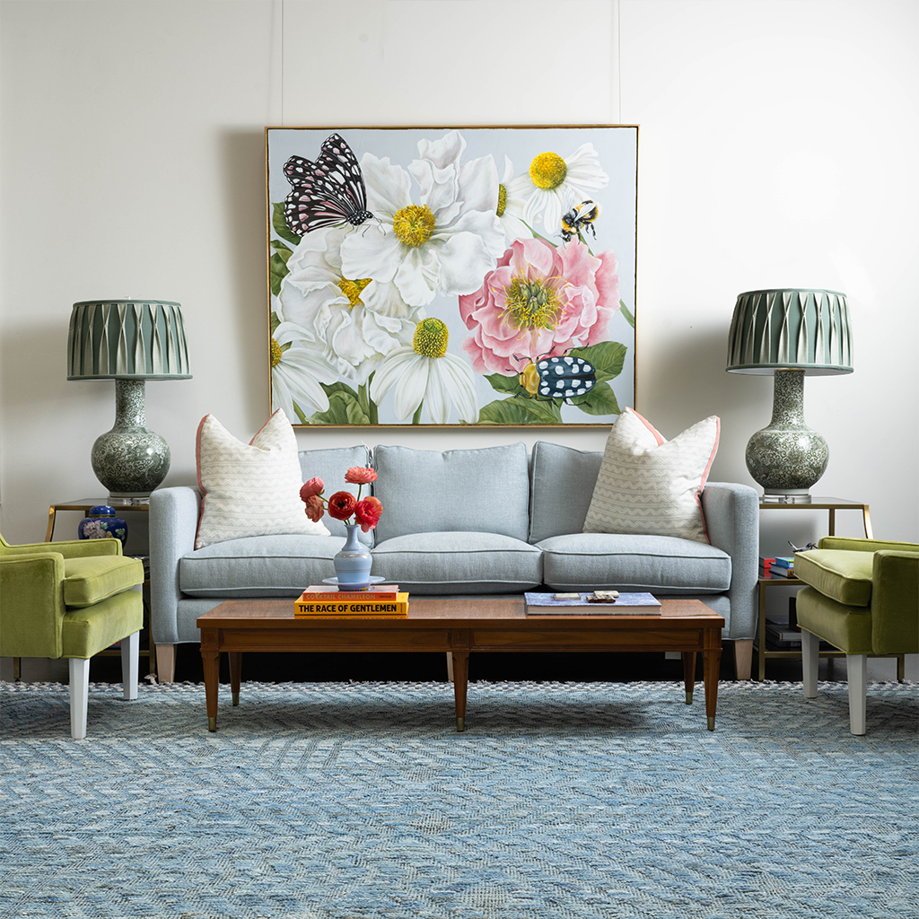 pale blue couch with green lamps