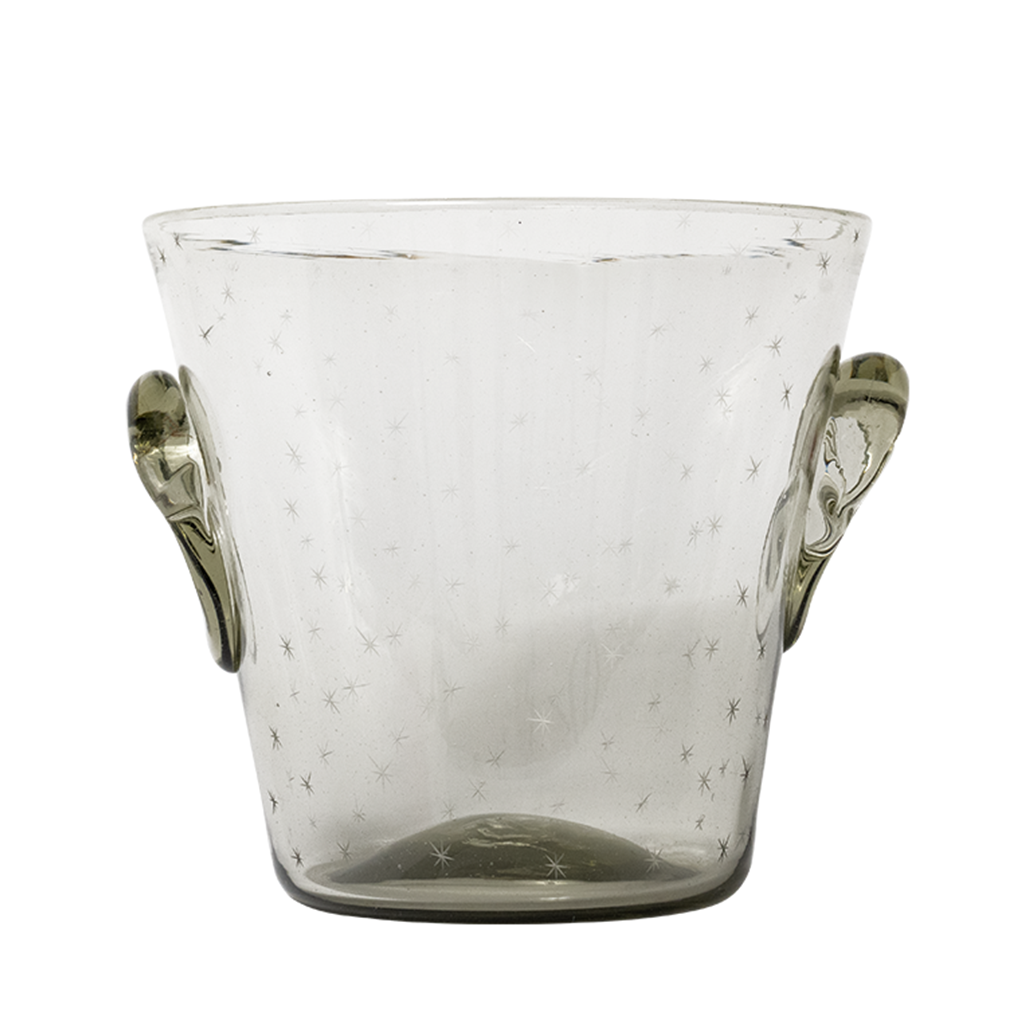A clear glass ice bucket with hand-etched designs and two handles on the sides.