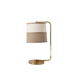 Table lamp with beige shade and brass arm on a white background