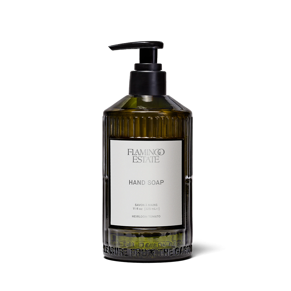 A bottle of Flaming Estate Hand Soap with a black pump dispenser and a white label, set against a plain white background.