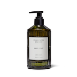 A bottle of Flaming Estate Hand Soap with a black pump dispenser and a white label, set against a plain white background.