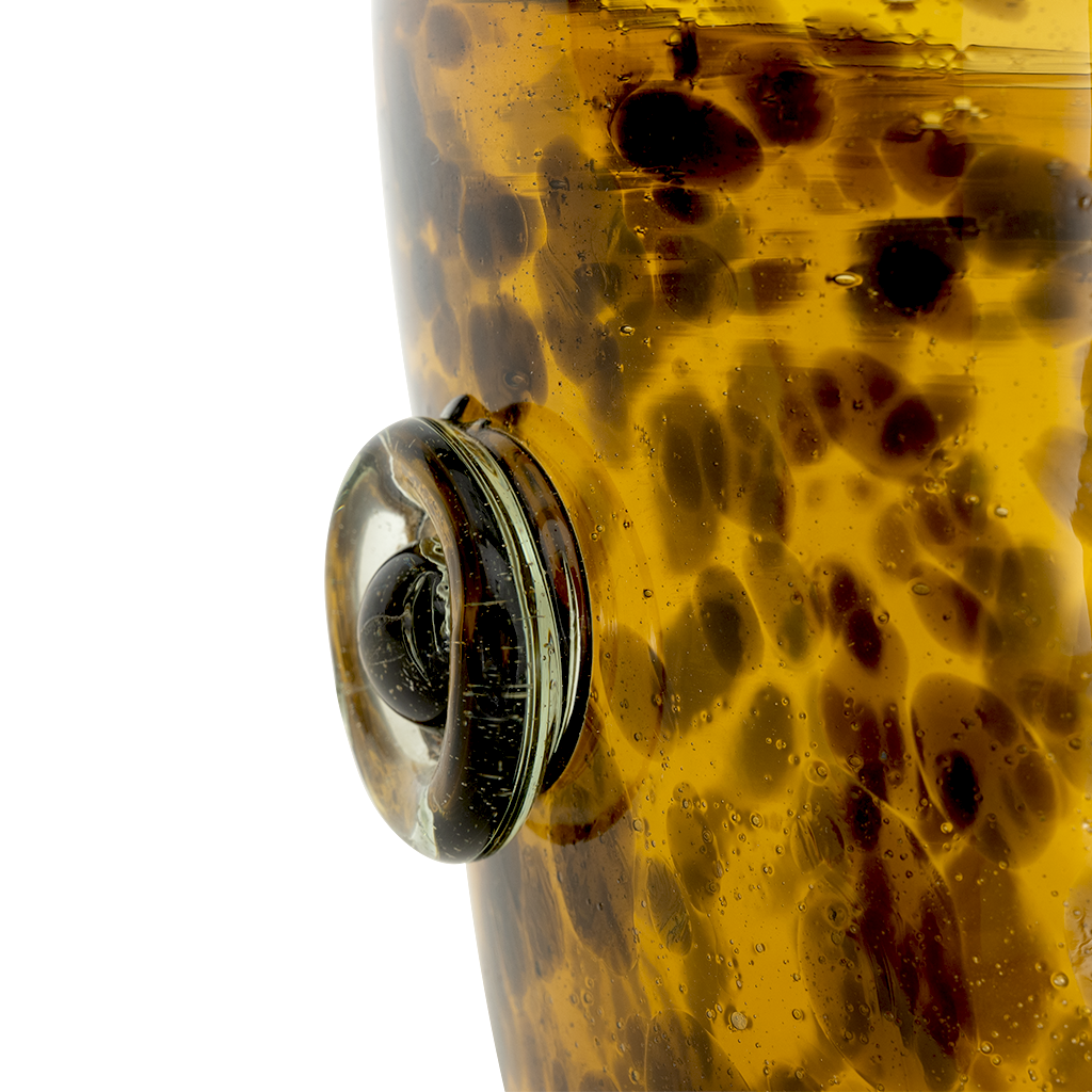 Close-up of a tortoiseshell-patterned ice bucket on a white background