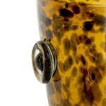 Close-up of a tortoiseshell-patterned ice bucket on a white background