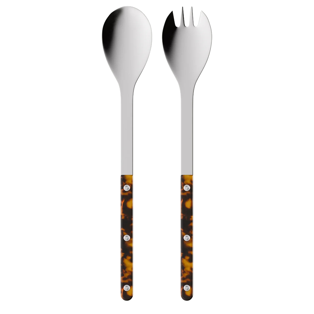Stainless steel utensil with tortoise handle on a white background