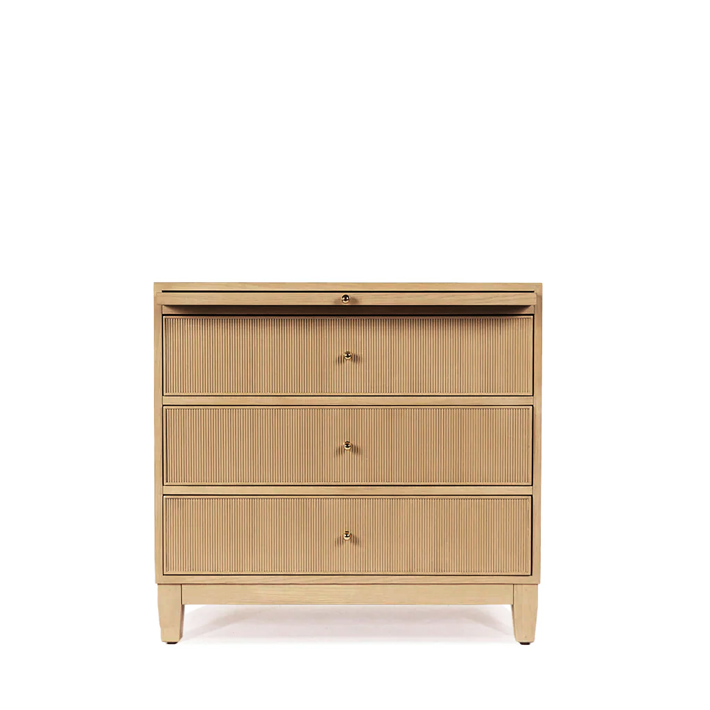 Beige dresser with three drawers on a white background