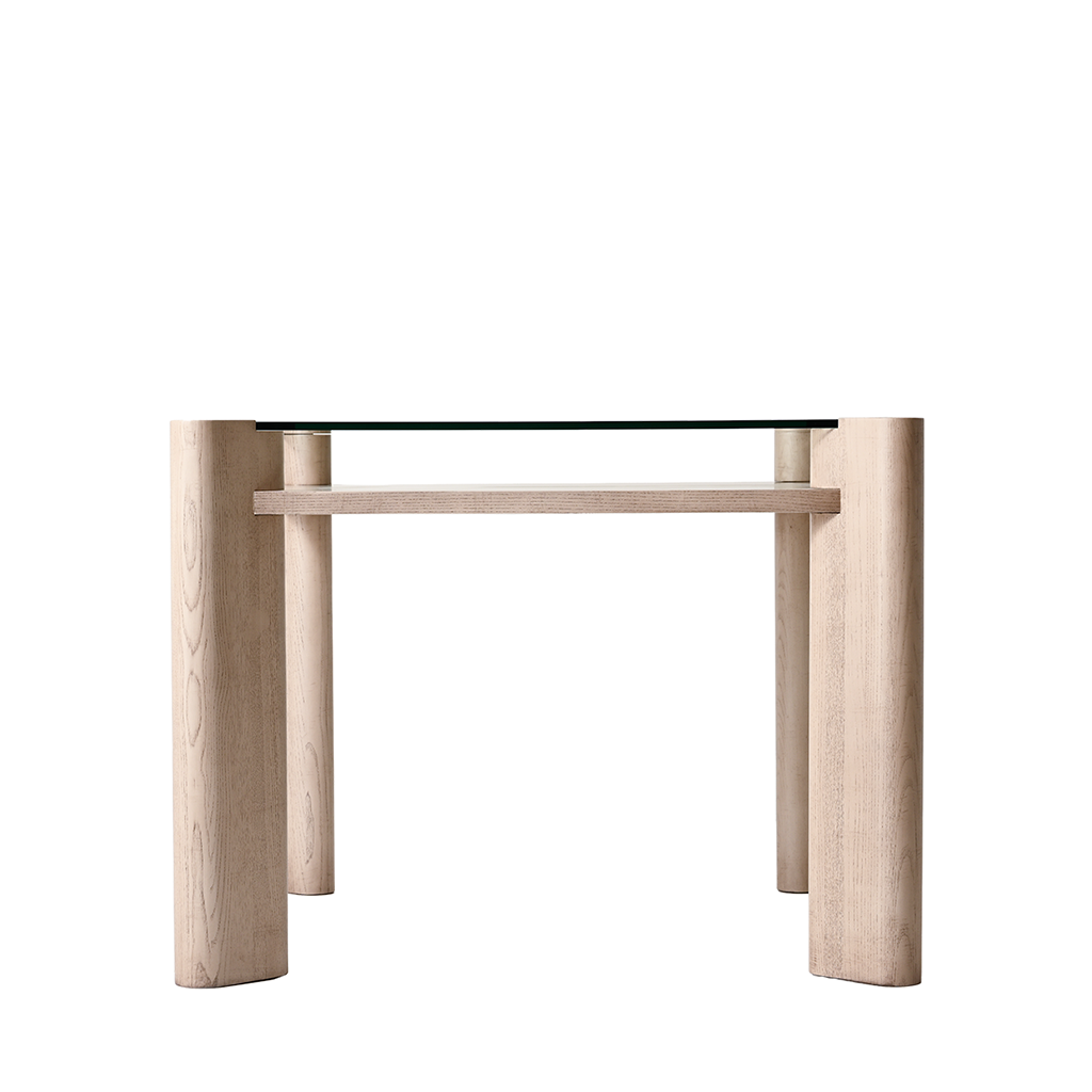 Glass-top table with wooden legs on a white background