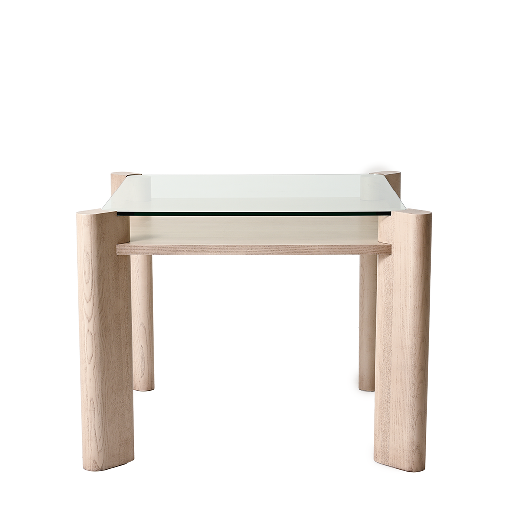 Glass top table with wooden legs on a white background