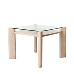 Square glass table with light wood legs on a white background