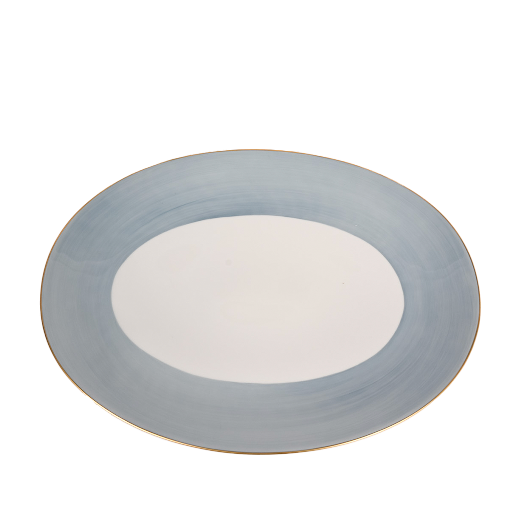 A lavender-colored Haviland & Parlon Lexington Large Oval Platter with gold detailing on the rim.