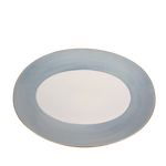 A lavender-colored Haviland & Parlon Lexington Large Oval Platter with gold detailing on the rim.