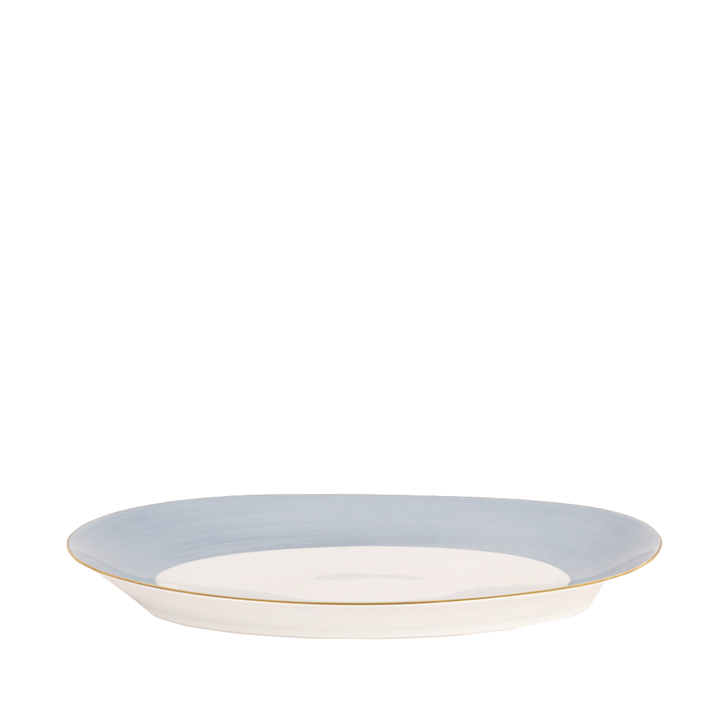 A lavender-colored Haviland & Parlon Lexington Large Oval Platter with gold detailing on the rim.