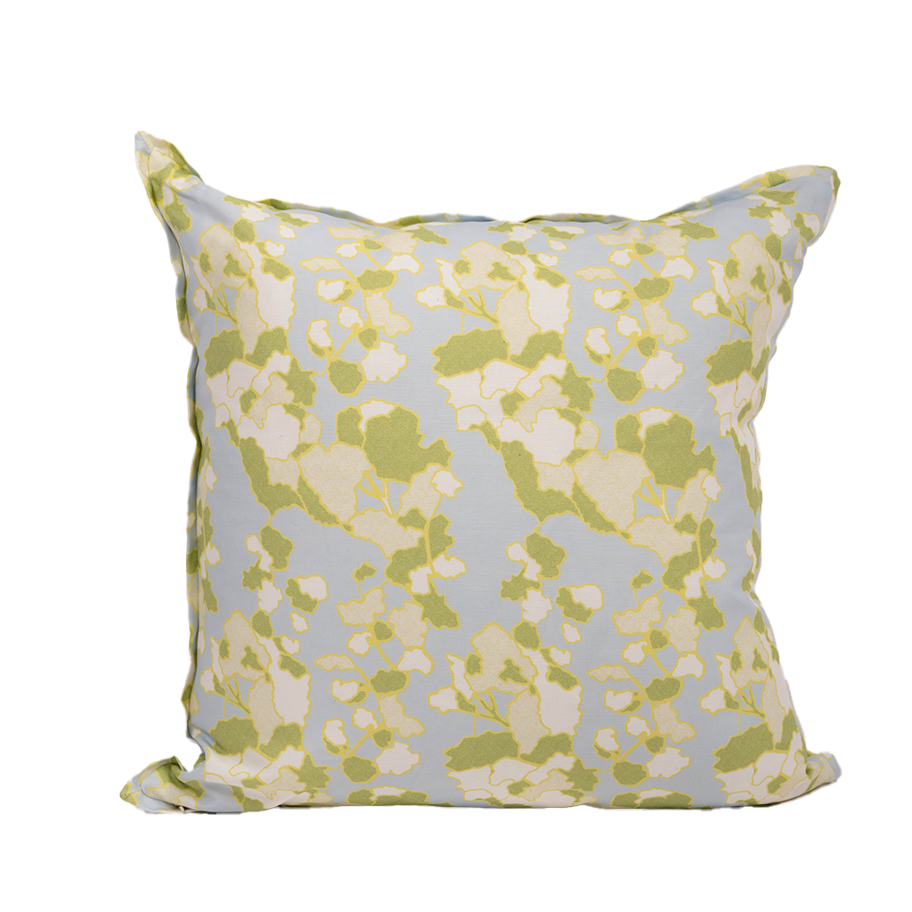 abstract green and cream floral design with powder blue background.