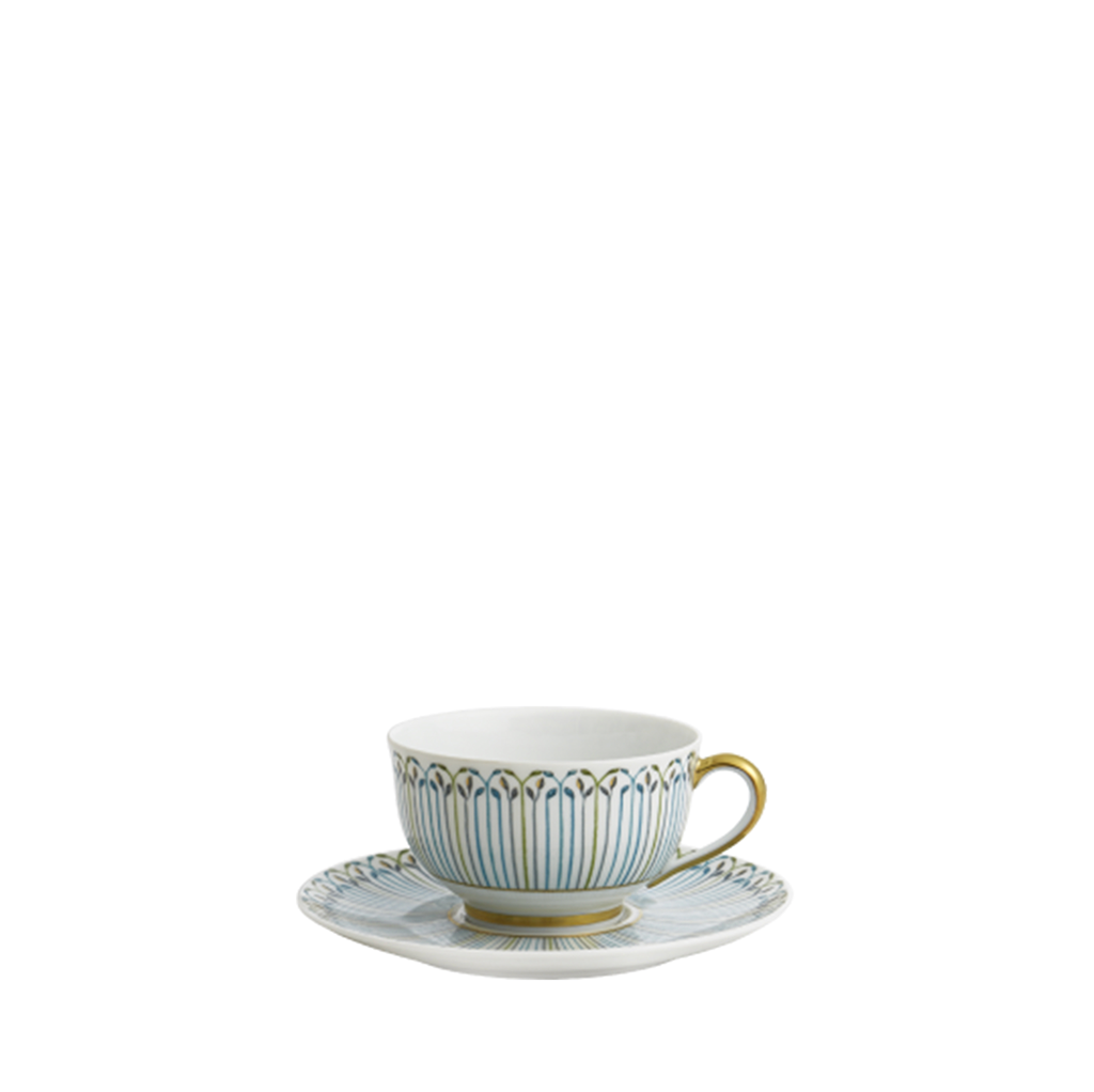 White porcelain tea cup and saucer with vertical blue stripes and gold trim detailing.