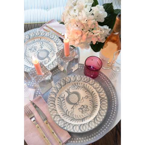 Olivia Dot Placemat in Rain paired with dinner plate, glassware, napkin, and flatware