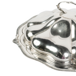 Up close shot of the silver tray with ridged edges, a dome lid with handle.