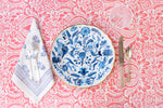 Land Sea & Sky Dinner Plate in Blue with flatware and napkin on top of tablecloth