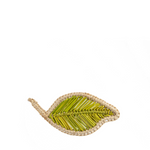 Woven Green and Natural Color Napkin Ring in the shape of a leaf