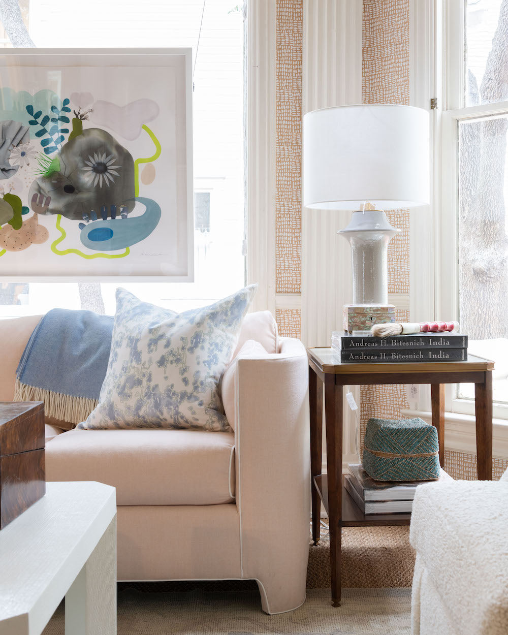 Soho Sofa styled in room with art, corner close up