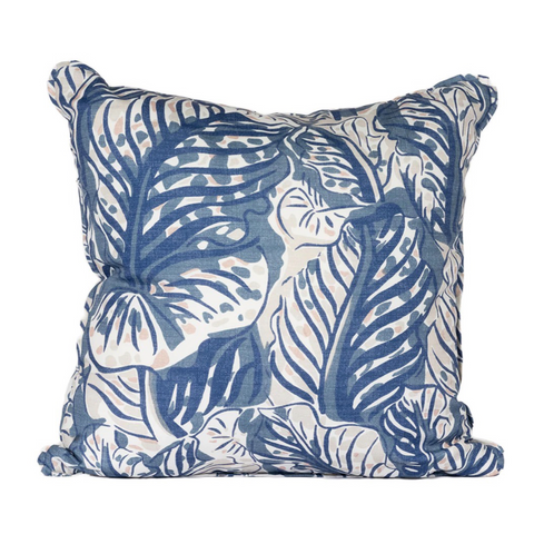 Cream pillow with blue palm leaves