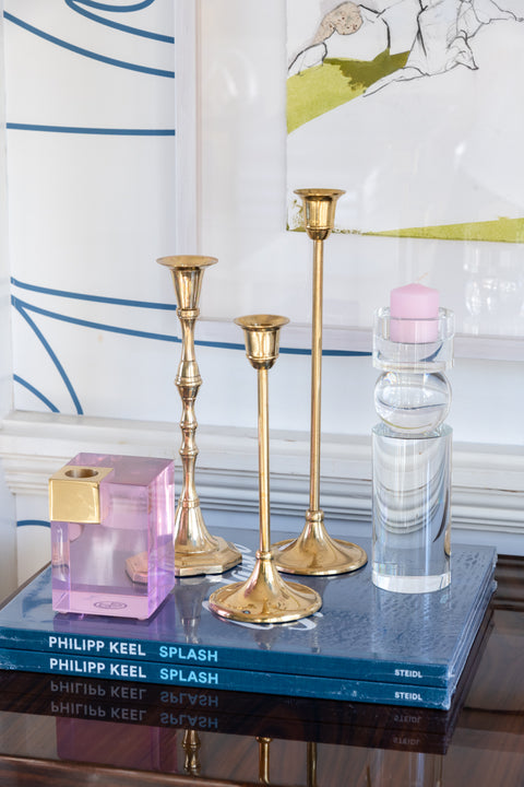 Gold 9" Candlestick displayed on coffee table book