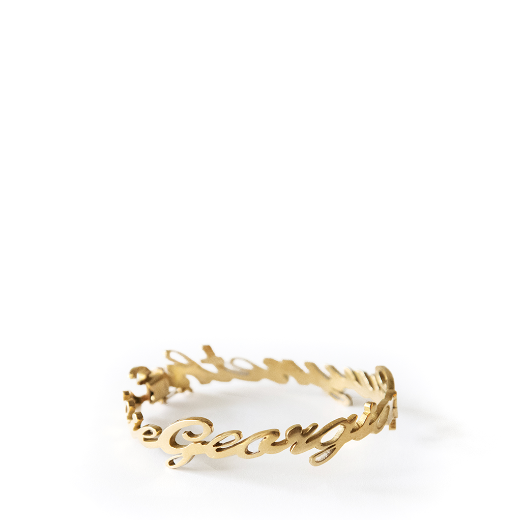 Yellow gold name bracelet with names in cursive font