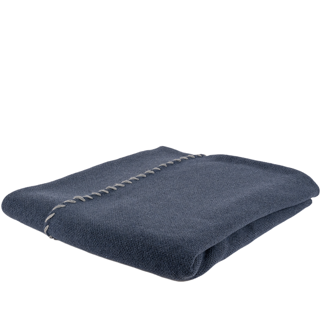navy blue throw folded alternately