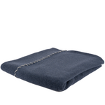 navy blue throw folded alternately