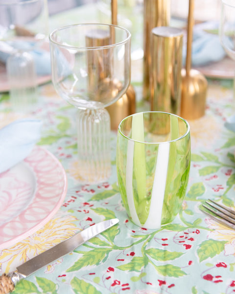 Green and White Striped Tumbler displayed on tablecloth