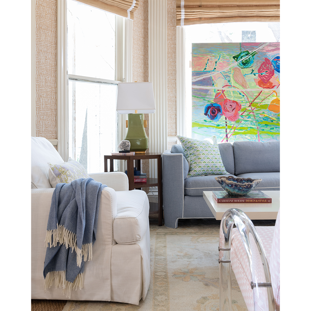 Sky throw blanket thrown over side of chair