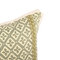 corner of green decorative patterned lumbar pillow showing trim detail