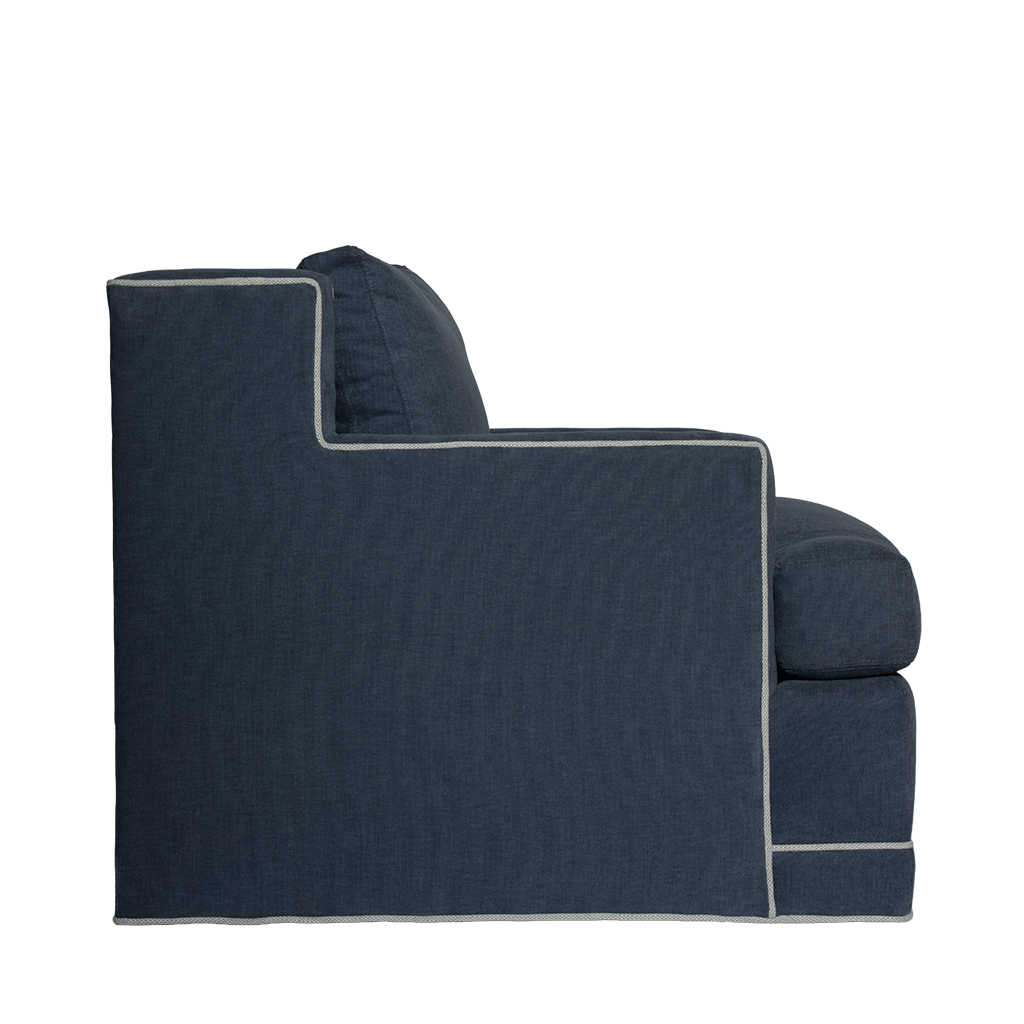 Dark blue sofa with quilted design on a white background