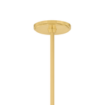A close-up of a modern ceiling light fixture's circular canopy and downrod in a brushed gold finish, shown against a solid white background.
