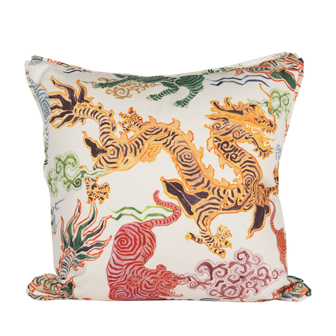 White pillow with orange dragon and red lion is colorful prints and patterns