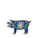Decorative pig figurine with intricate blue and green patterns on a white background