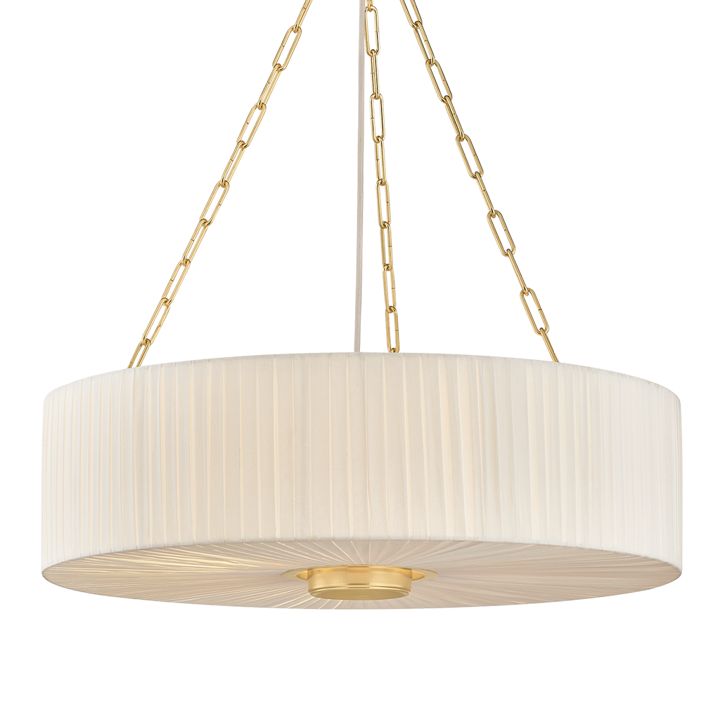 A modern drum pendant light with a pleated off-white fabric shade and a brushed gold metal frame, suspended by three gold chains against a white background.