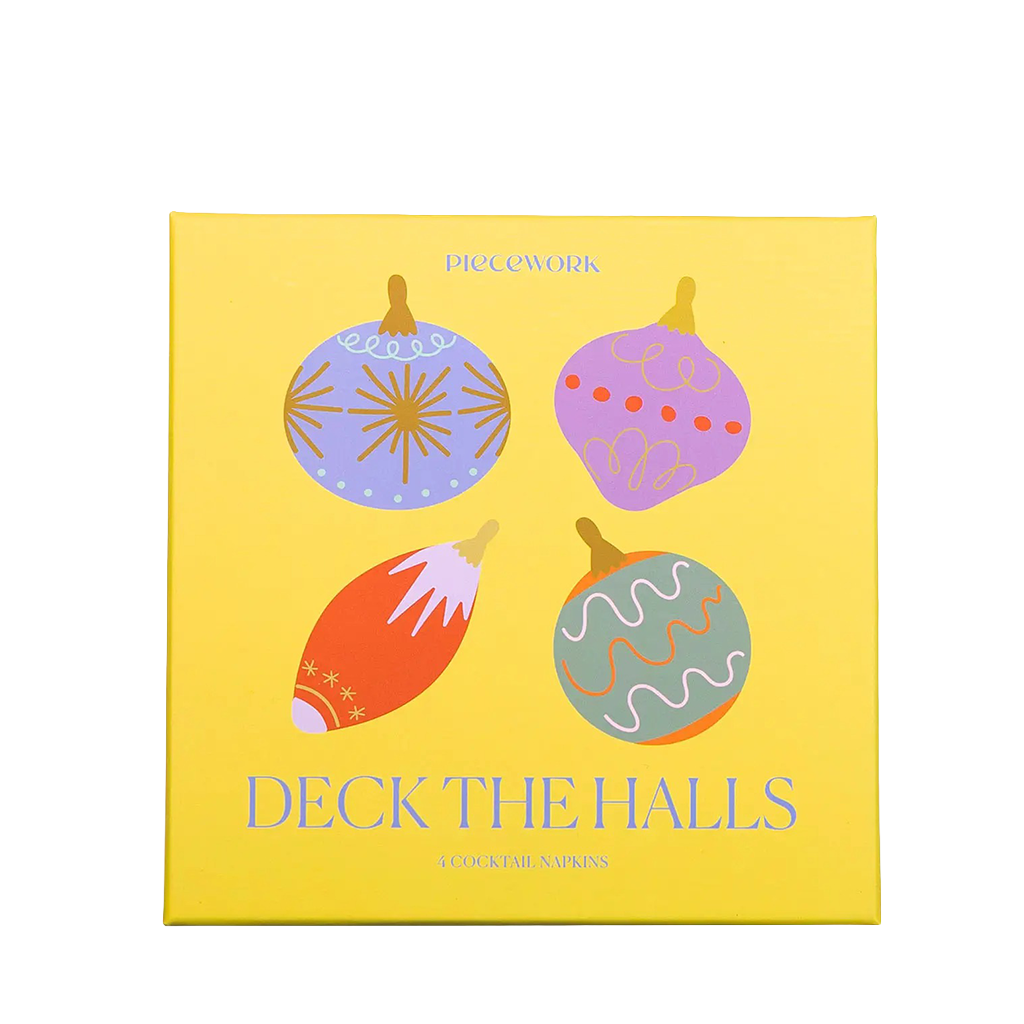 A square yellow card or box cover for 'Deck the Halls' by Pico Cowork, featuring four colorful Christmas ornament illustrations in purple, orange, green, and blue on a white background.