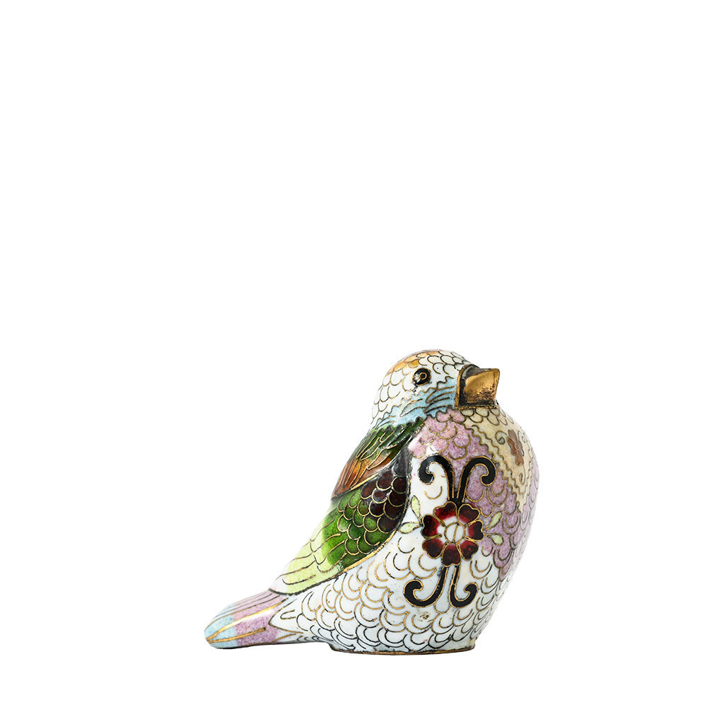 Decorative bird figurine with floral design on a white background