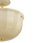 Close-up of a cream-colored semi-flush mount ceiling light fixture with a fluted glass shade and gold-toned metal hardware, shown against a plain white background.