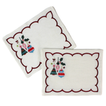 Two white embroidered square napkins with scalloped burgundy edges and a small Christmas ornament design in the lower left corner, shown on a white background.