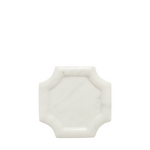 A small octagonal white marble tray with a smooth, polished surface and subtle gray veining, centered on a solid white background.