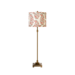 Decorative lamp with floral patterned shade on a white background