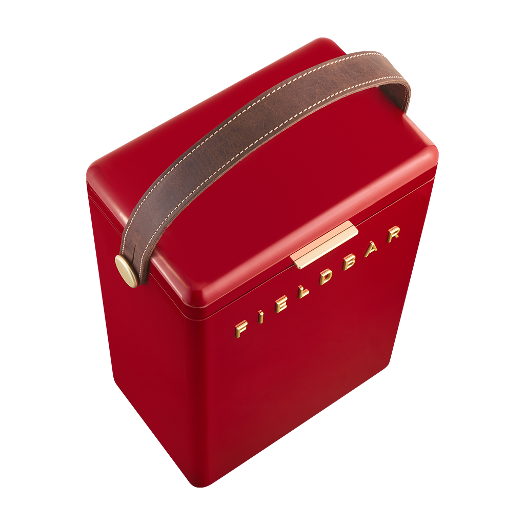 A red metal Fieldbar wine cooler with a brown faux-leather handle and gold lettering on a white background.