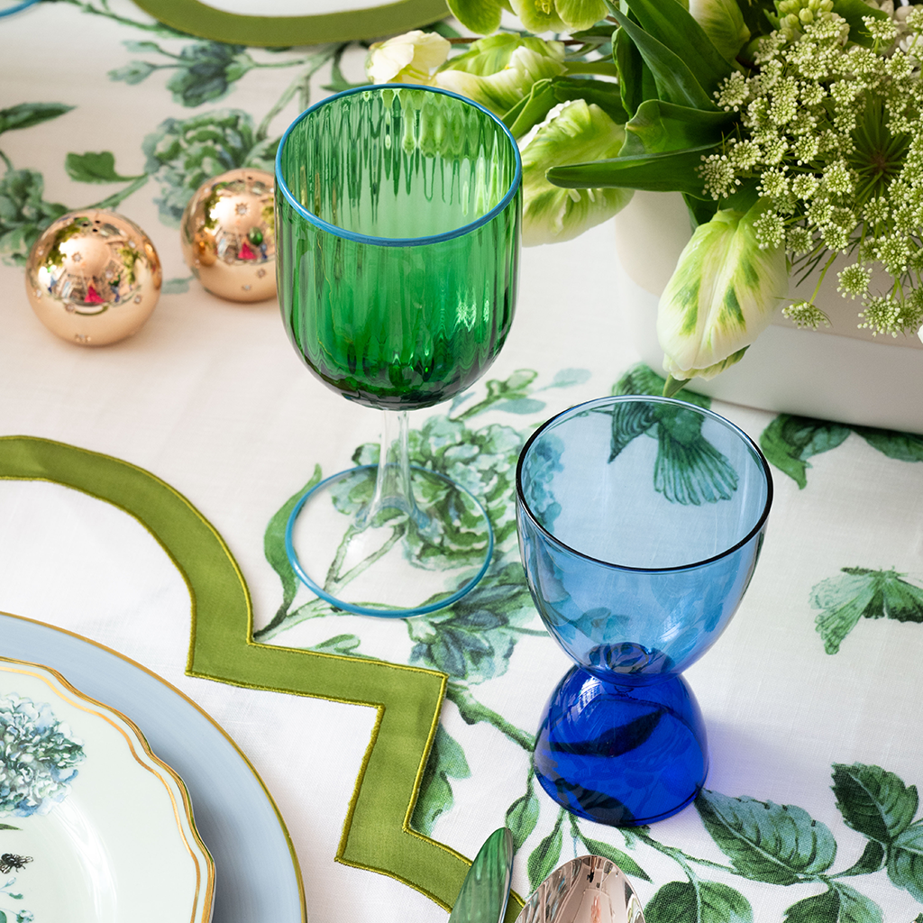 Emerald Wine Glass with ridges on the top of the glass next to a blue wine glass