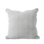A square decorative throw pillow features a soft white fabric with a delicate blue vertical stripe and floral pattern. The textured design and muted color palette give it a classic, relaxed look.