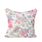 Decorative pillow with floral and bird pattern on a white background