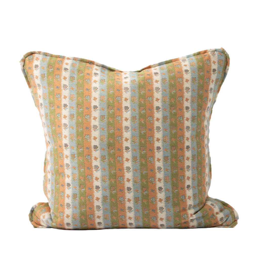 A square decorative throw pillow features alternating vertical stripes in muted peach, sage green, and ivory with a delicate floral pattern throughout. The soft, vintage-inspired color palette gives the pillow a warm and inviting look.