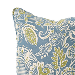 Decorative pillow with a blue and green paisley pattern on a white background