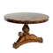 Beaux Wooden Table. A flat circular top with intricate legs and a glossy finish