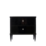 Front view of an antique ebonized two-drawer chest with a glossy black finish, clean lines, and tapered legs. Ivory-colored shield-shaped keyhole escutcheons provide a subtle contrast, emphasizing the piece's refined Biedermeier design.